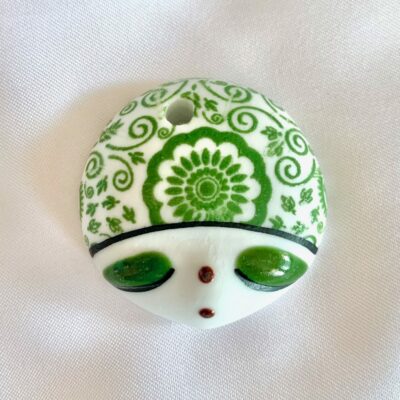 Hand Painted Green Doll Face with Floral Folk Art Motif Focal Round Ceramic Pendant